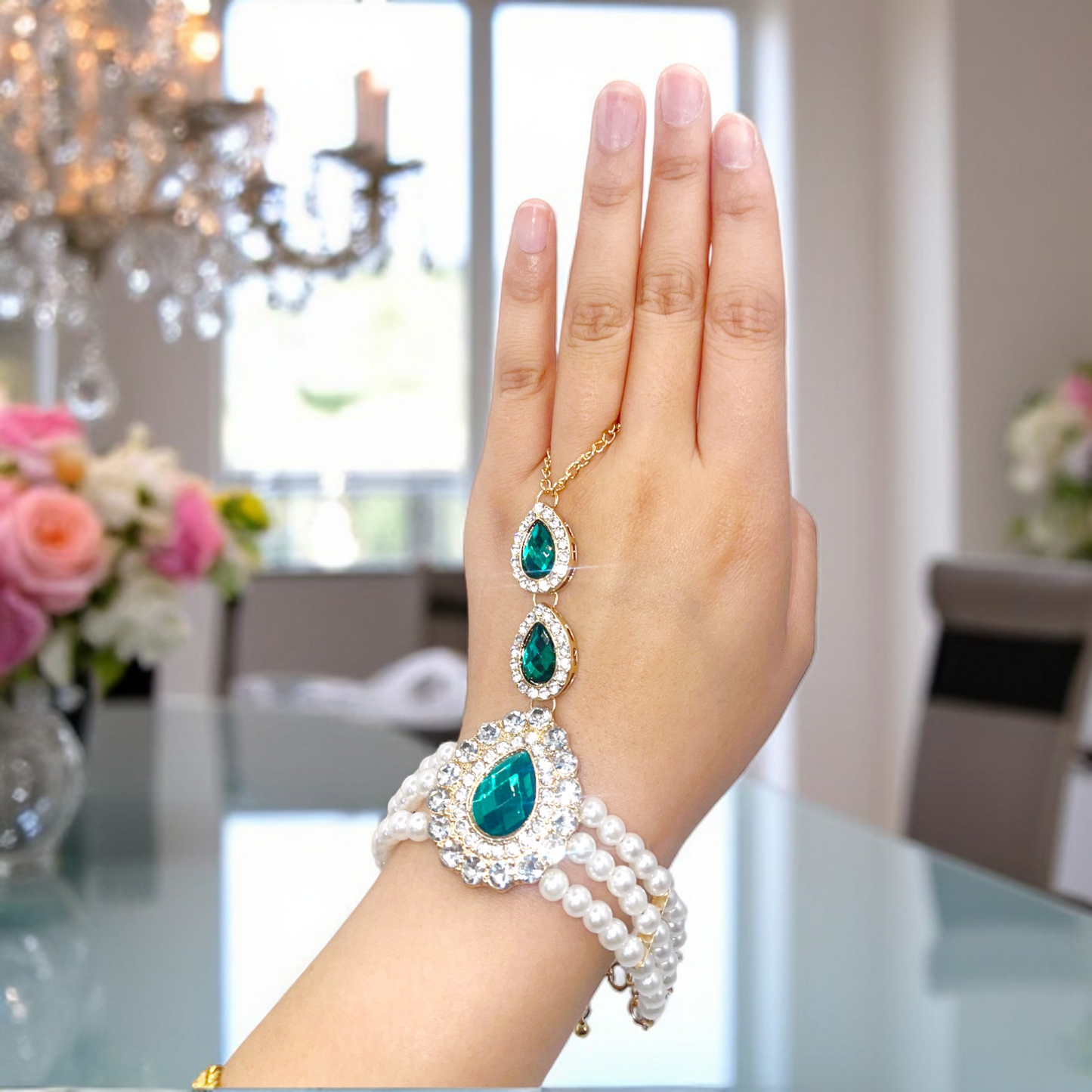 Emerald Pearl Hand Chain Bracelet – Elegant hand chain bracelet with emerald stones and pearls, perfect for weddings and special occasions.