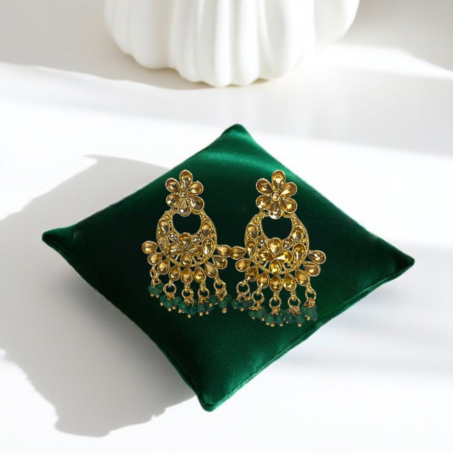 Kundan Emerald Whisper Jewelry Set – Artificial gold-tone earrings featuring emerald stones and Kundan detailing.