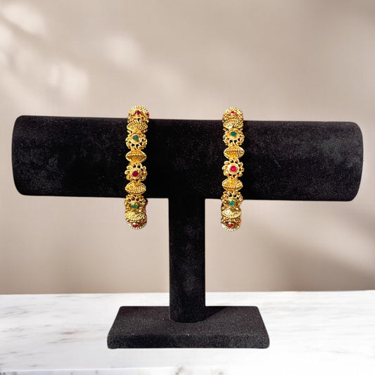 Regal Blossoms Gold Forming Bangle – Artificial gold-plated bangle with vibrant synthetic gemstones, perfect for weddings and special occasions.