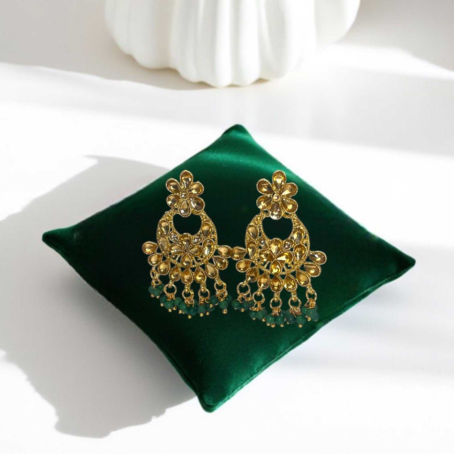 Kundan Emerald Whisper Jewelry Set – Artificial gold-tone earrings featuring emerald stones and Kundan detailing.