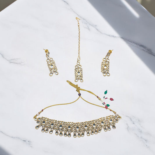 Polki-Inspired Jewelry Set worn with an elegant outfit, showcasing the artificial stones and gold-plated design.

