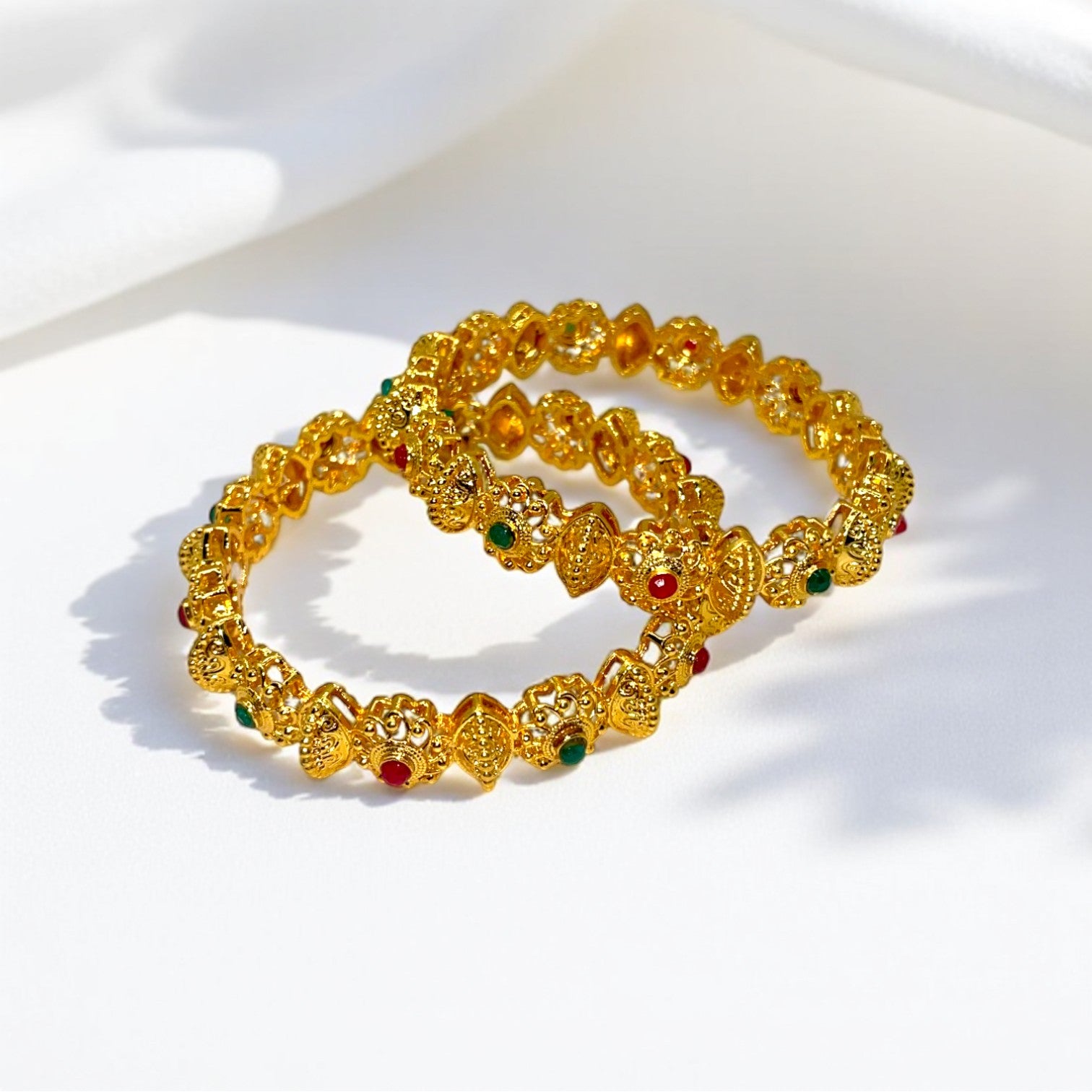 Regal Blossoms Gold Forming Bangle – Artificial gold-plated bangle with vibrant synthetic gemstones, perfect for weddings and special occasions.
